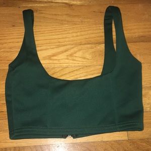 Forest green, zip up top. Runs a little small.